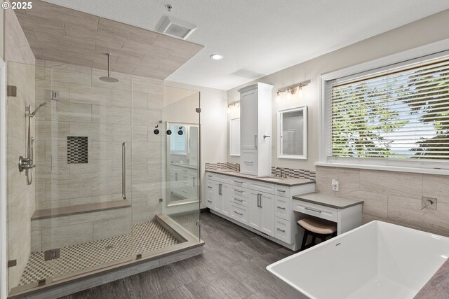 15110 Oyer Dr, Oregon City, OR 97045 - bathroom with a stall shower, vanity, a freestanding bath, and recessed lighting