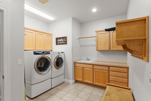 15110 Oyer Dr, Oregon City, OR 97045 - laundry room with washing machine and clothes dryer, cabinet space, light tile patterned floors, and recessed lighting