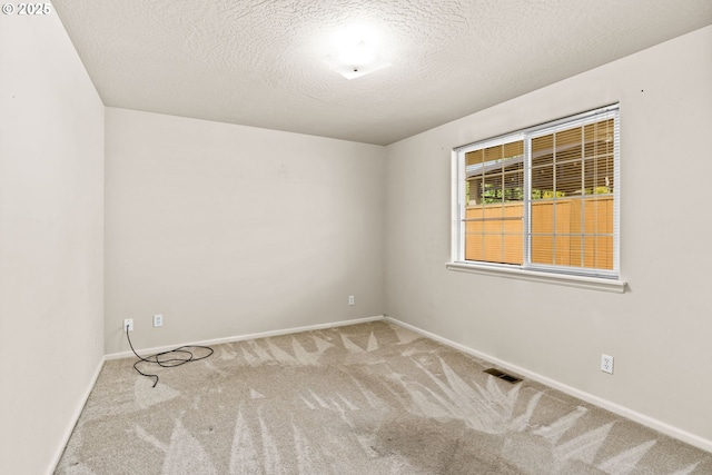2494 Cubit St, Eugene, OR 97402 - carpeted spare room with baseboards and a textured ceiling