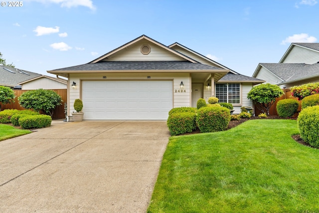 2494 Cubit St, Eugene, OR 97402 - ranch-style house with concrete driveway, roof with shingles, and a garage