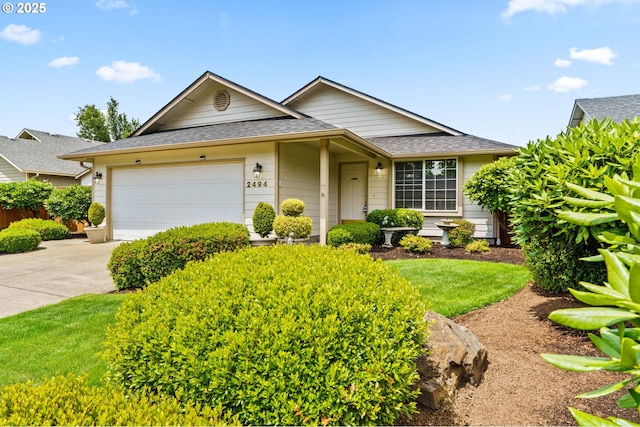 2494 Cubit St, Eugene, OR 97402 - view of front of home featuring an attached garage, driveway, and a shingled roof