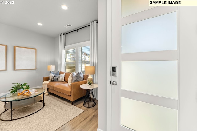 living room featuring recessed lighting and light wood finished floors