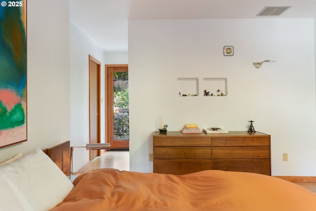 bedroom featuring visible vents