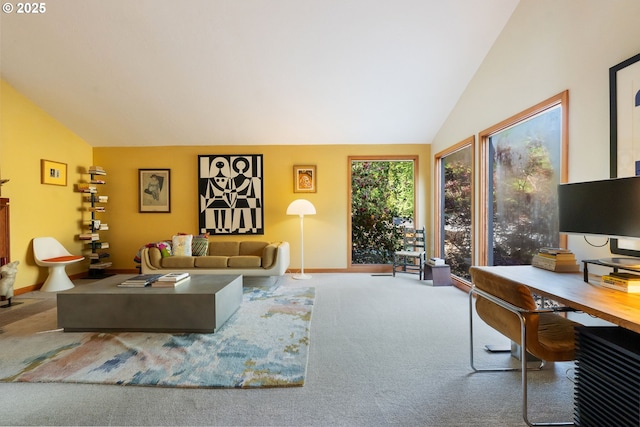 living area featuring baseboards, carpet flooring, and lofted ceiling
