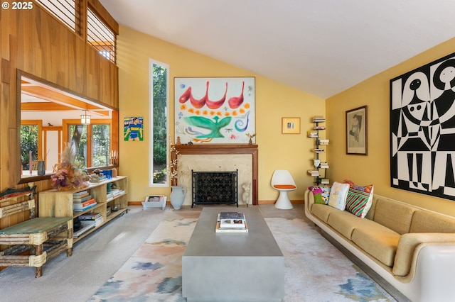 living room with a fireplace with flush hearth, baseboards, and light colored carpet