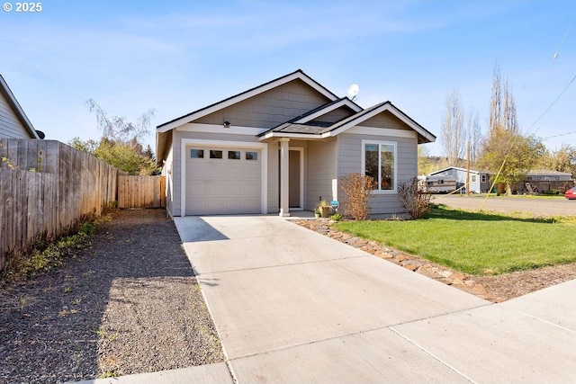 902 SE 3rd St, Prineville, OR 97754 - view of front of property featuring driveway, fence, a front lawn, and an attached garage