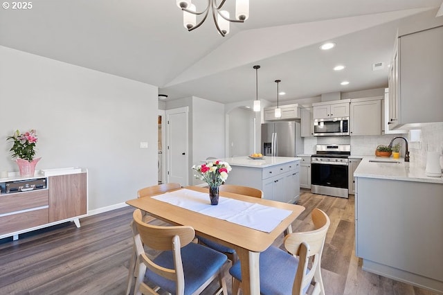 902 SE 3rd St, Prineville, OR 97754 - dining area with recessed lighting, a chandelier, visible vents, light wood-style flooring, and vaulted ceiling