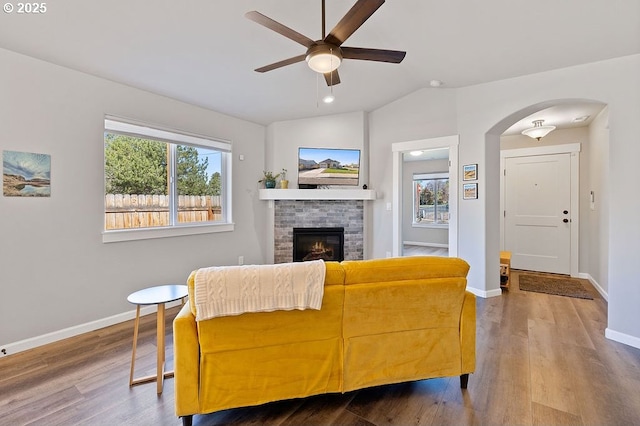 902 SE 3rd St, Prineville, OR 97754 - living room featuring wood finished floors, ceiling fan, baseboards, and arched walkways