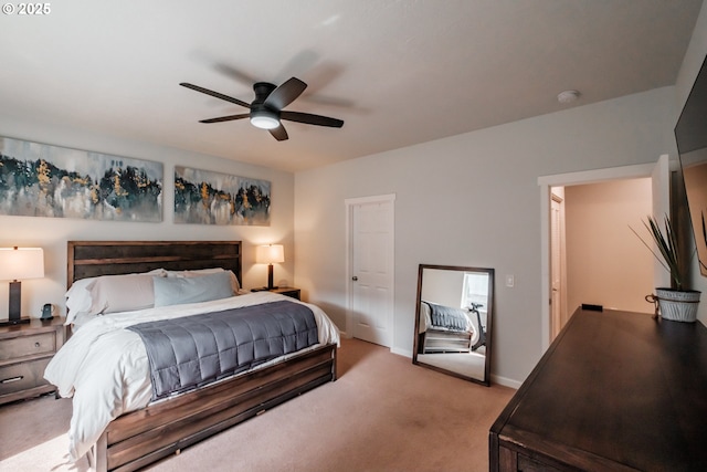 bedroom featuring baseboards, a ceiling fan, and light colored carpet