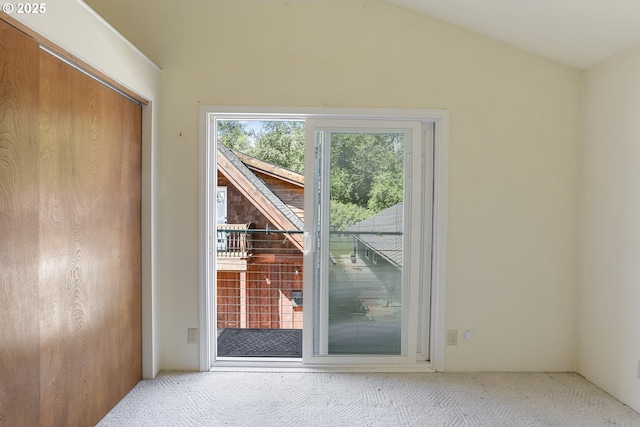 26400 NW St Helens Rd Unit 57, Scappoose, OR 97056 - doorway featuring carpet floors and vaulted ceiling