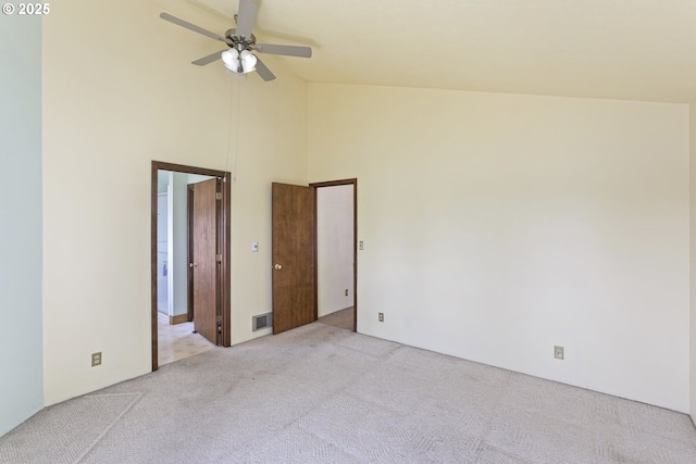 26400 NW St Helens Rd Unit 57, Scappoose, OR 97056 - unfurnished room featuring carpet flooring, high vaulted ceiling, and ceiling fan