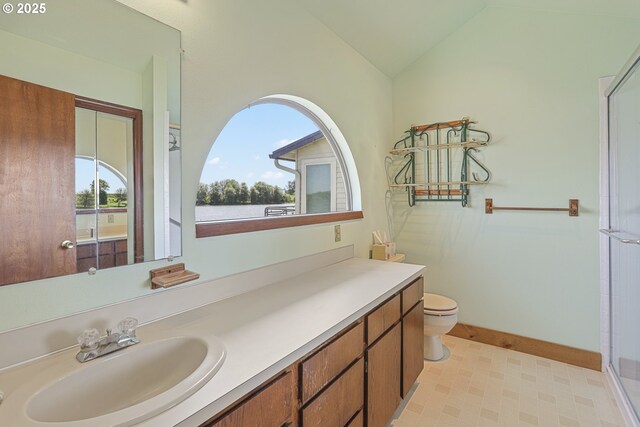 26400 NW St Helens Rd Unit 57, Scappoose, OR 97056 - full bath featuring toilet, vanity, vaulted ceiling, an enclosed shower, and tile patterned floors