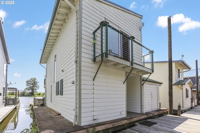 26400 NW St Helens Rd Unit 57, Scappoose, OR 97056 - rear view of property with a deck with water view and a balcony