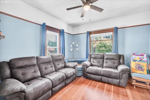 8014 N Johnswood Dr, Portland, OR 97203 - living room with a textured ceiling, light wood-style floors, and a ceiling fan