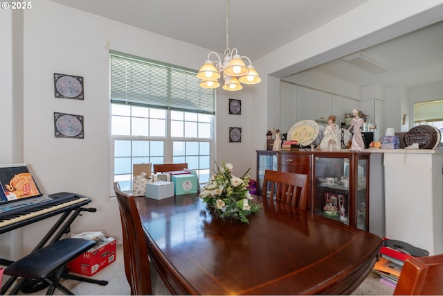 dining area with a notable chandelier