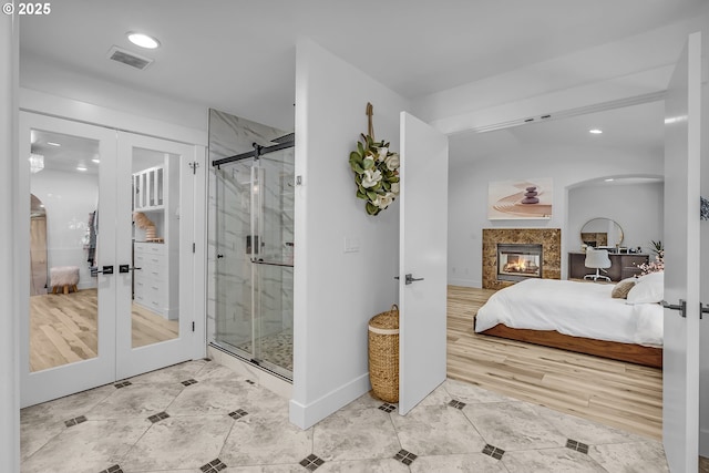 2646 N Lambert St, Cornelius, OR 97113 - ensuite bathroom featuring french doors, tile patterned flooring, a marble finish shower, recessed lighting, and a high end fireplace