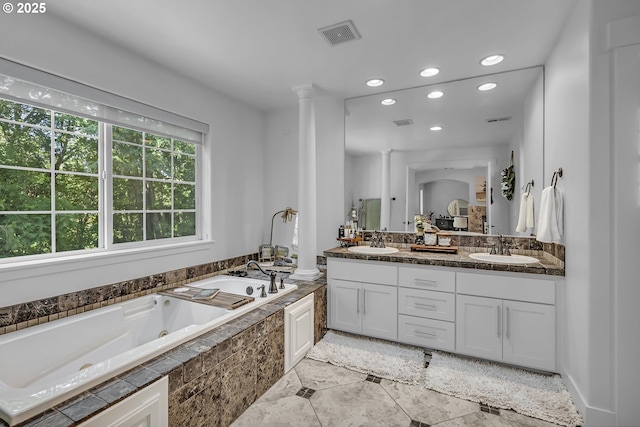2646 N Lambert St, Cornelius, OR 97113 - bathroom featuring double vanity, a jetted tub, recessed lighting, decorative columns, and tile patterned floors