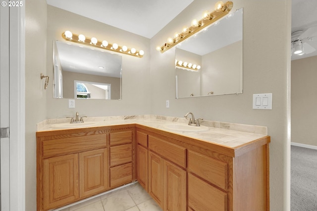 bathroom featuring double vanity and a sink
