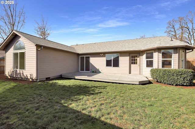 back of property with a deck, a yard, and crawl space