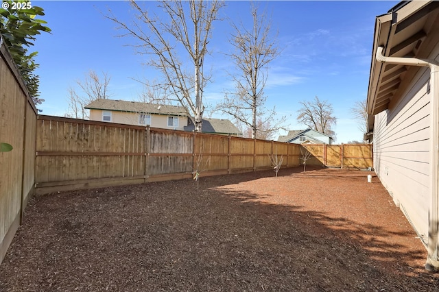 view of yard with a fenced backyard