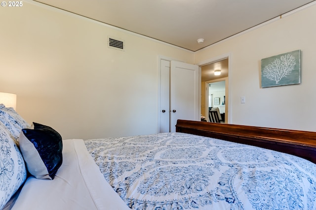 bedroom featuring visible vents