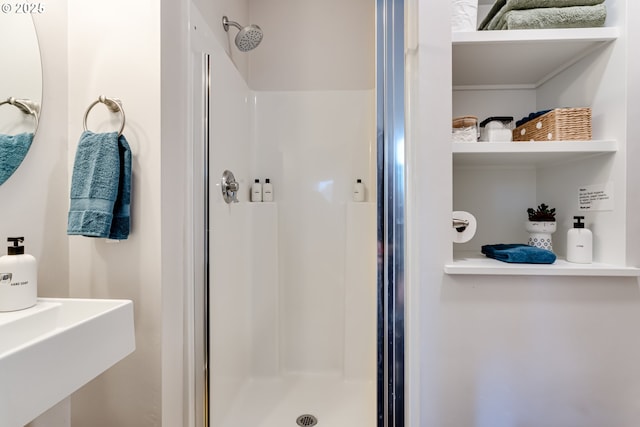 bathroom featuring a shower stall
