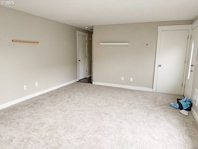 empty room featuring carpet floors