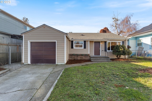 ranch-style house featuring a front lawn and a garage