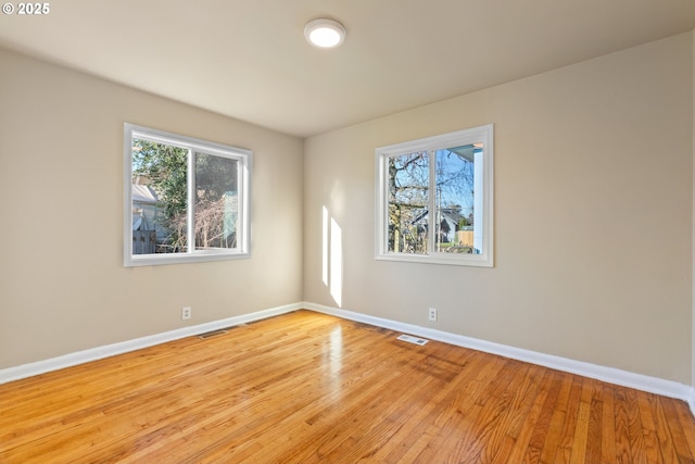 empty room with light hardwood / wood-style floors