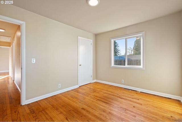 spare room featuring light hardwood / wood-style flooring