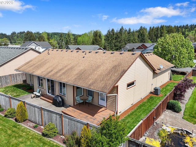 153 Sandwedge Ct, Chehalis, WA 98532 - back of house with central AC unit, a wooden deck, and a shingled roof