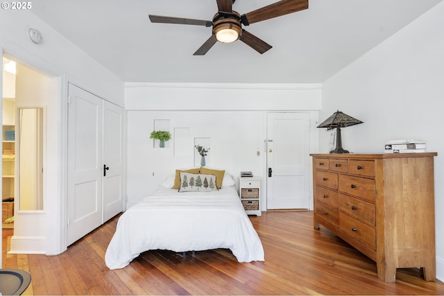 bedroom featuring a ceiling fan and light wood-type flooring