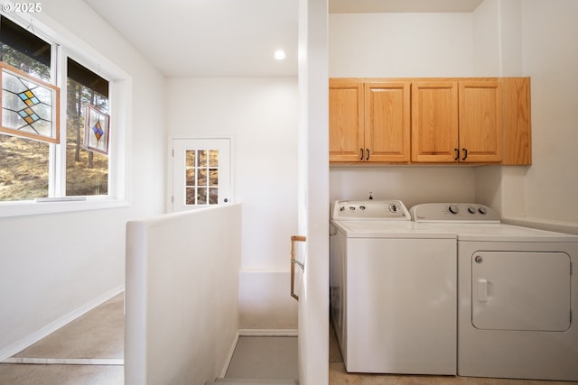 washroom with baseboards, recessed lighting, cabinet space, and washer and dryer