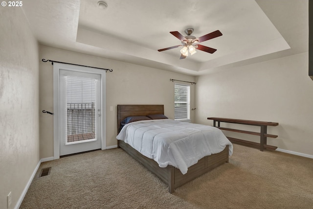 3435 Meadow View Dr, Eugene, OR 97408 - bedroom featuring a tray ceiling, carpet flooring, access to exterior, and baseboards