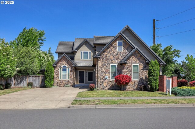 3435 Meadow View Dr, Eugene, OR 97408 - craftsman-style home with stone siding, a tiled roof, and driveway