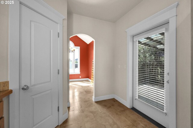 3435 Meadow View Dr, Eugene, OR 97408 - hall with arched walkways, plenty of natural light, baseboards, and light tile patterned floors