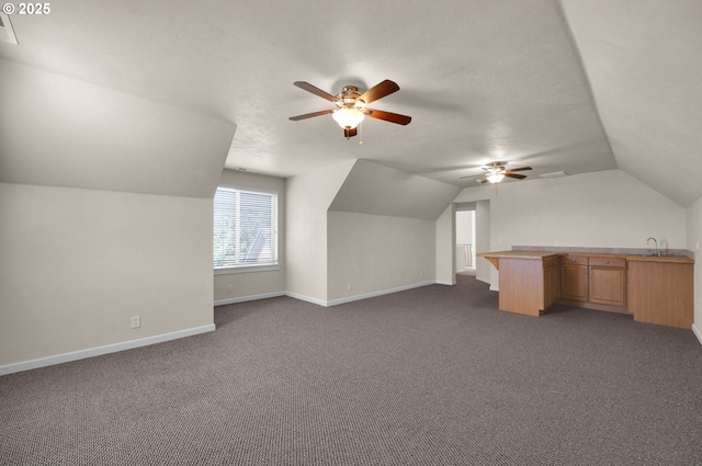 3435 Meadow View Dr, Eugene, OR 97408 - additional living space with a ceiling fan, lofted ceiling, baseboards, dark colored carpet, and a sink