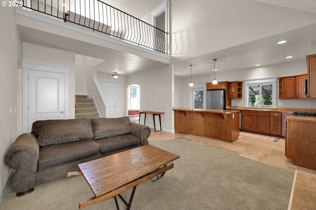 3435 Meadow View Dr, Eugene, OR 97408 - living area featuring a high ceiling, plenty of natural light, stairway, recessed lighting, and arched walkways