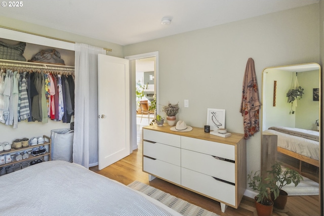7615 SE 66th Ave, Portland, OR 97206 - bedroom with a closet, light wood finished floors, and baseboards