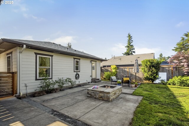 7615 SE 66th Ave, Portland, OR 97206 - back of property featuring a patio and an outdoor fire pit