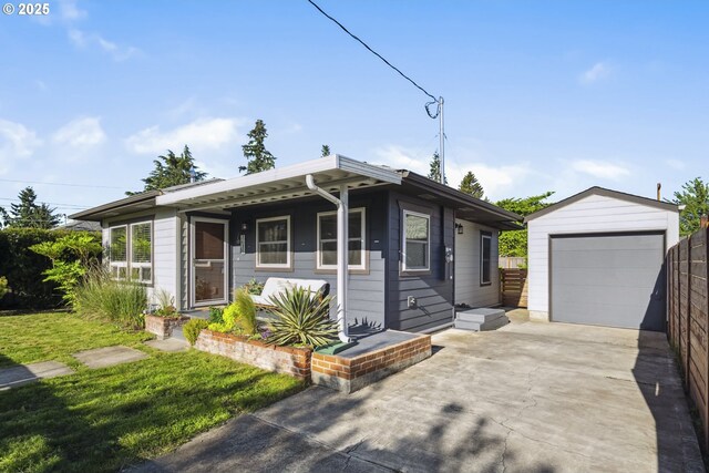 7615 SE 66th Ave, Portland, OR 97206 - view of front of home with concrete driveway, an outbuilding, and a garage