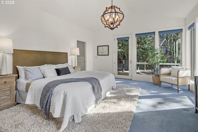 bedroom featuring access to exterior, a notable chandelier, lofted ceiling, and carpet