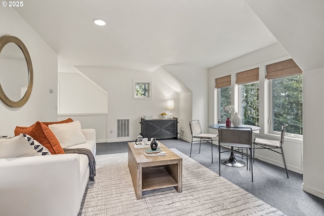 carpeted living area with recessed lighting, baseboards, and visible vents