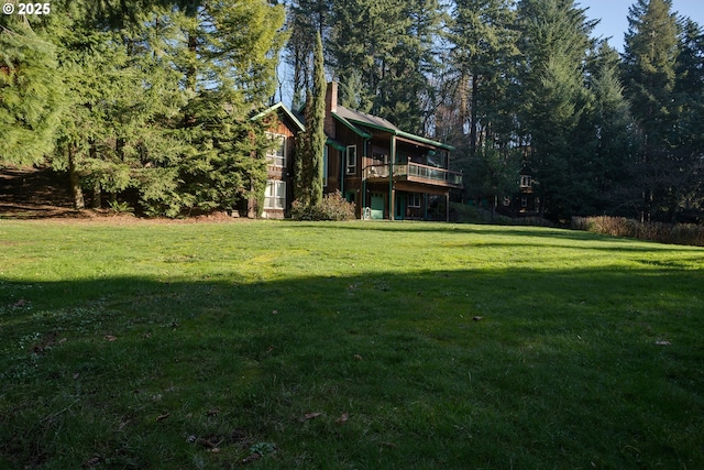 view of yard with a wooden deck