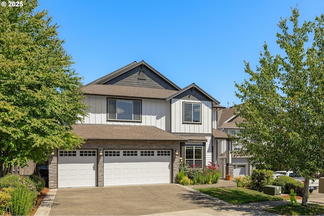 14746 SW 148th Ter, Tigard, OR 97224 - craftsman-style house featuring board and batten siding, concrete driveway, a garage, and stone siding