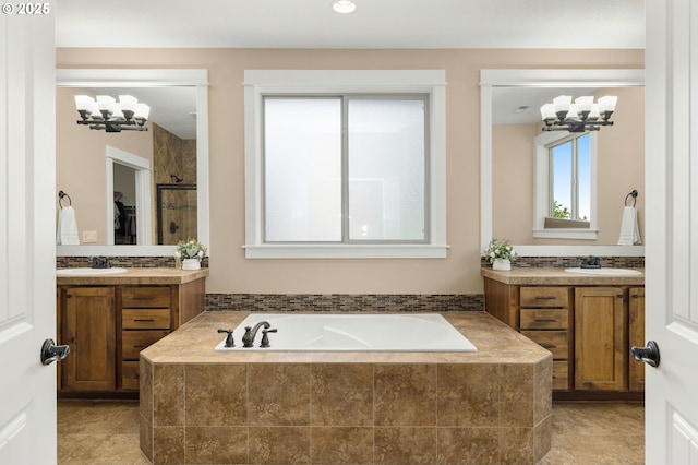 14746 SW 148th Ter, Tigard, OR 97224 - full bathroom featuring a chandelier, a garden tub, and two vanities