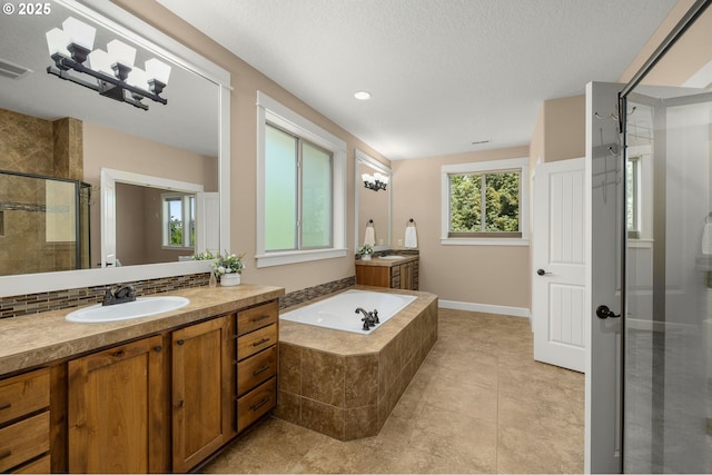 14746 SW 148th Ter, Tigard, OR 97224 - full bath with a stall shower, two vanities, a bath, tile patterned floors, and tasteful backsplash