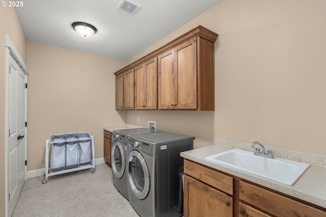 14746 SW 148th Ter, Tigard, OR 97224 - laundry room with cabinet space and washer and clothes dryer
