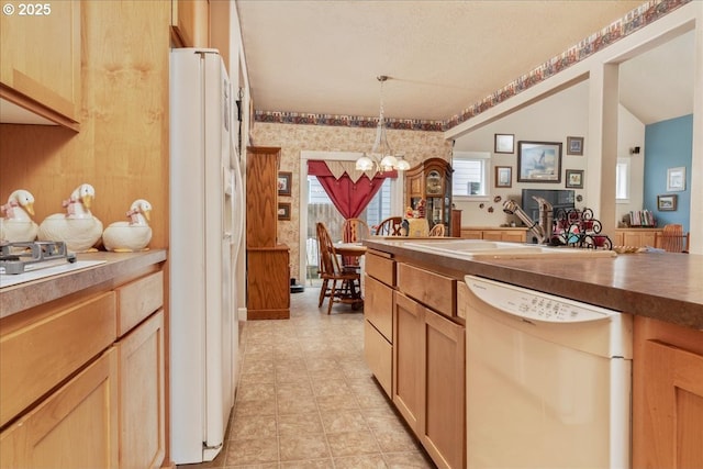 1703 Webb Lake Dr, Silverton, OR 97381 - kitchen with white appliances, wallpapered walls, a sink, pendant lighting, and an inviting chandelier