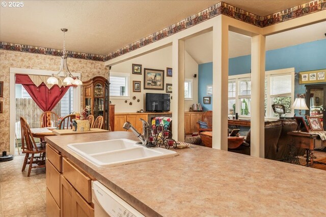 1703 Webb Lake Dr, Silverton, OR 97381 - kitchen with pendant lighting, a sink, a notable chandelier, and open floor plan